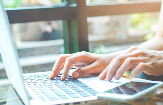 Person typing on laptop