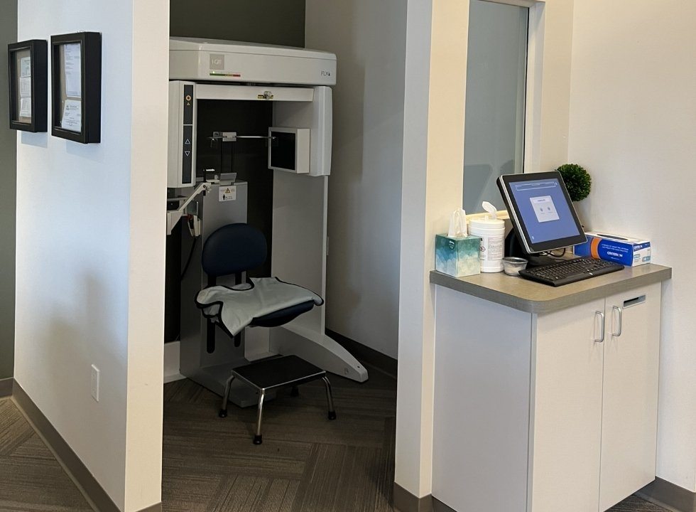 Small room in dental office with cone beam C T scanner