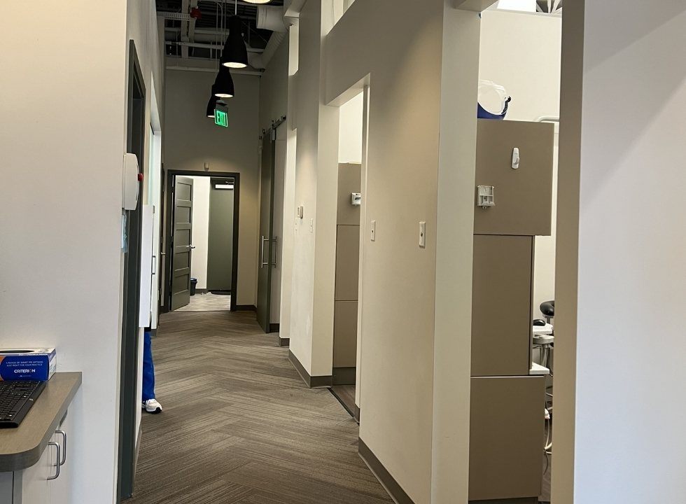 Hallway branching off into dental treatment rooms